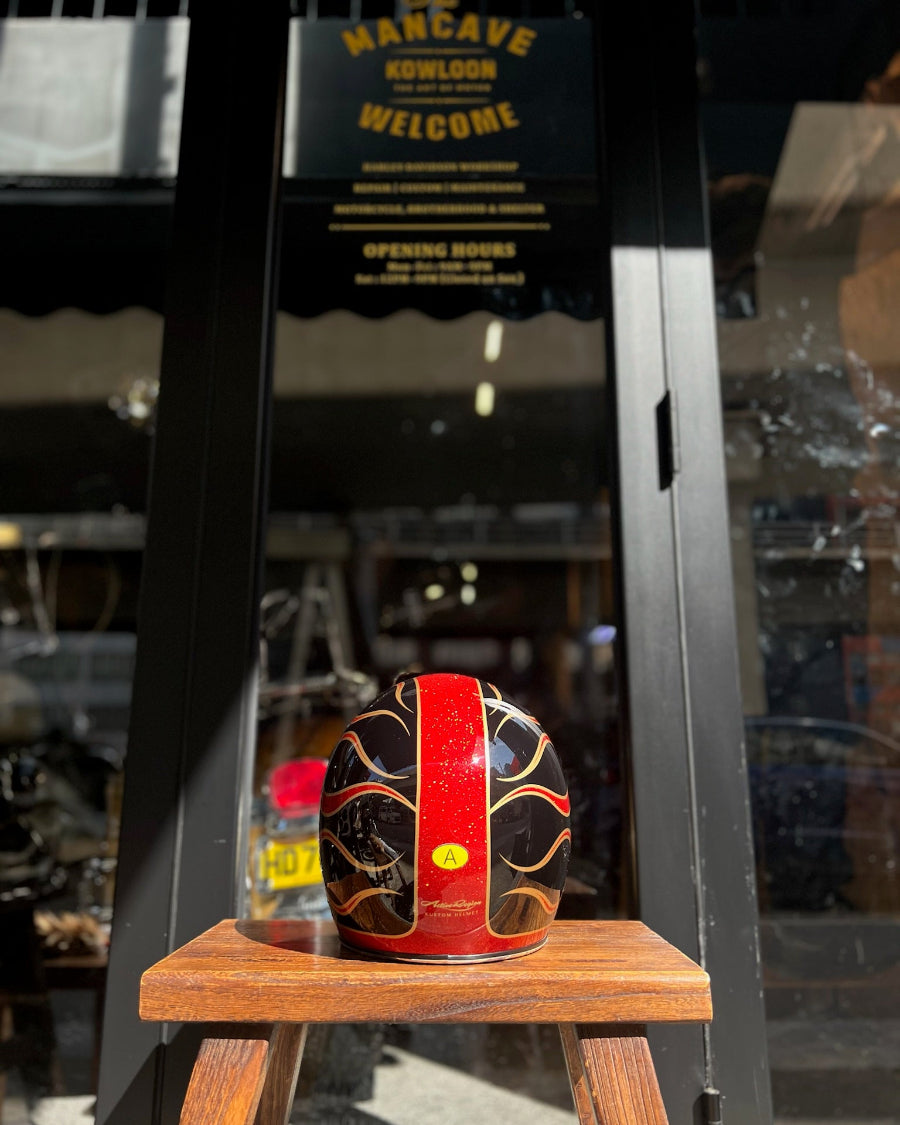 Decorative object on a wooden stand with a store sign in the background