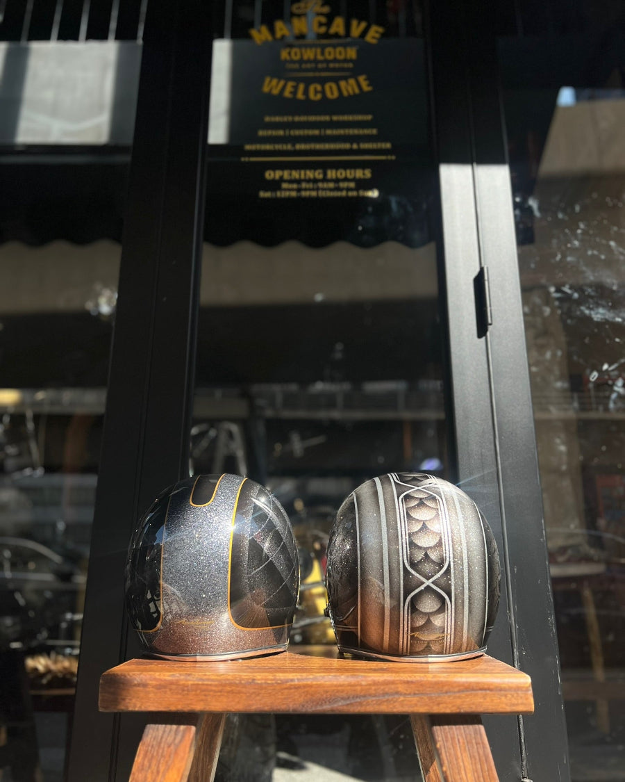 Two metallic objects on a wooden stand with a blurred background