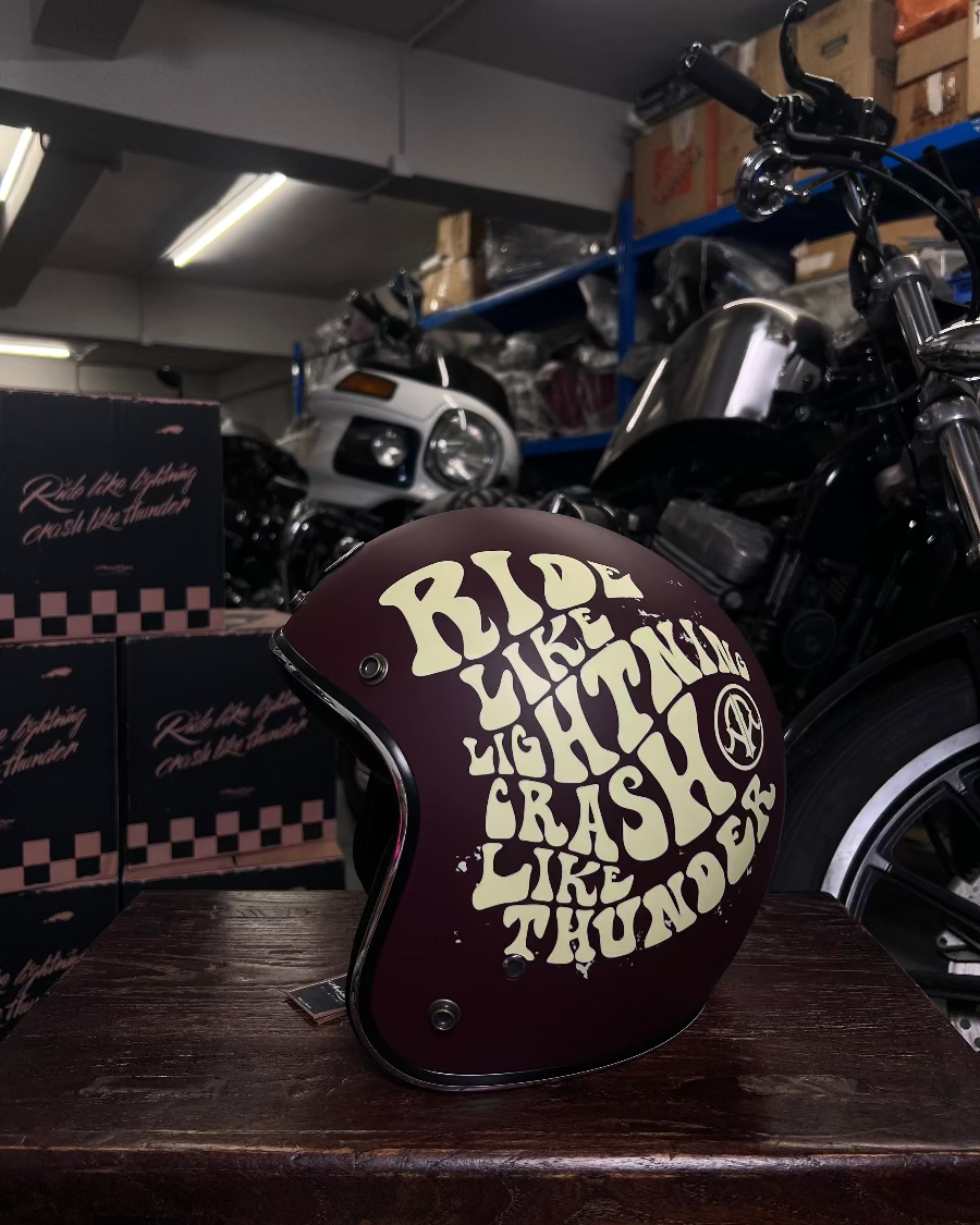 Motorcycle helmet with text in a garage setting