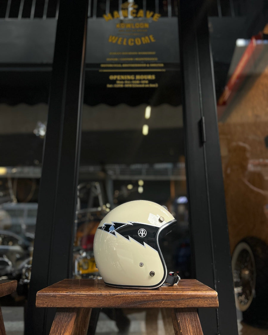Vintage-style helmet on a wooden stool with a blurred background of a cafe.