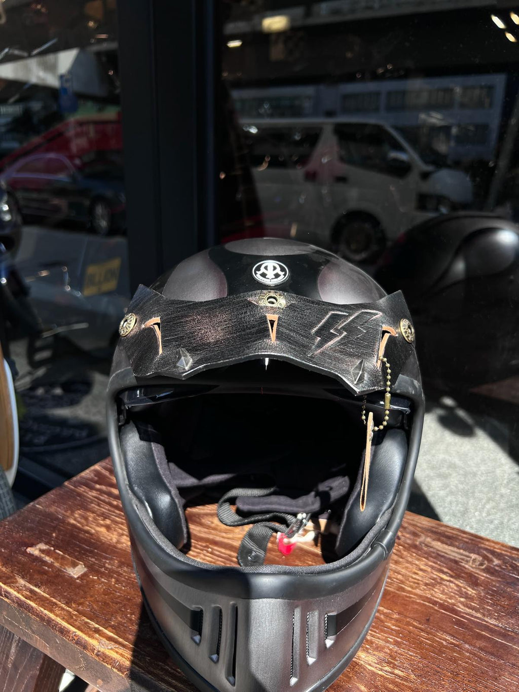 Taiwan brand Air Runner helmet and Urban Soul leather visor display in The Mancave Kowloon Harley Davidson motorcycles repair shop