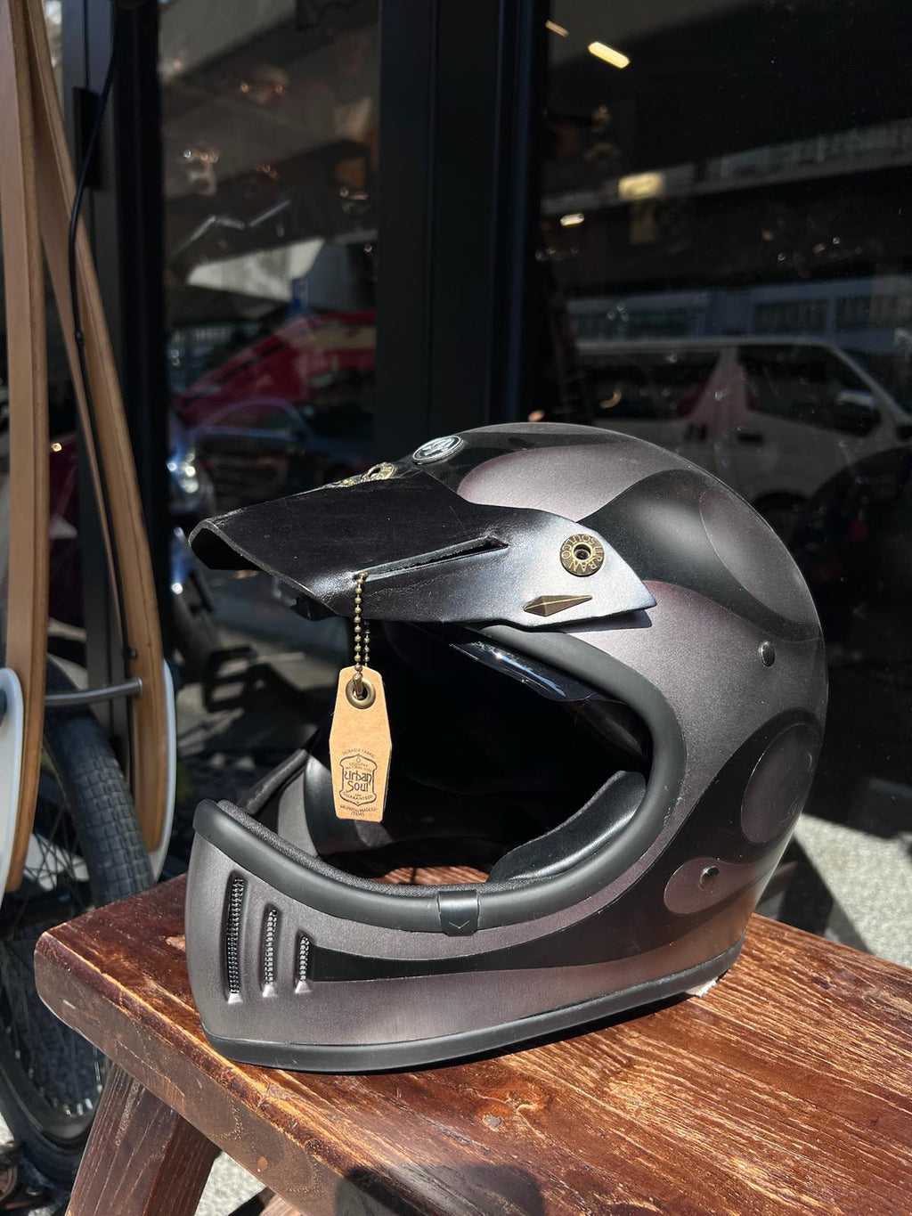 Taiwan brand Air Runner helmet and Urban Soul leather visor display in The Mancave Kowloon Harley Davidson motorcycles repair shop