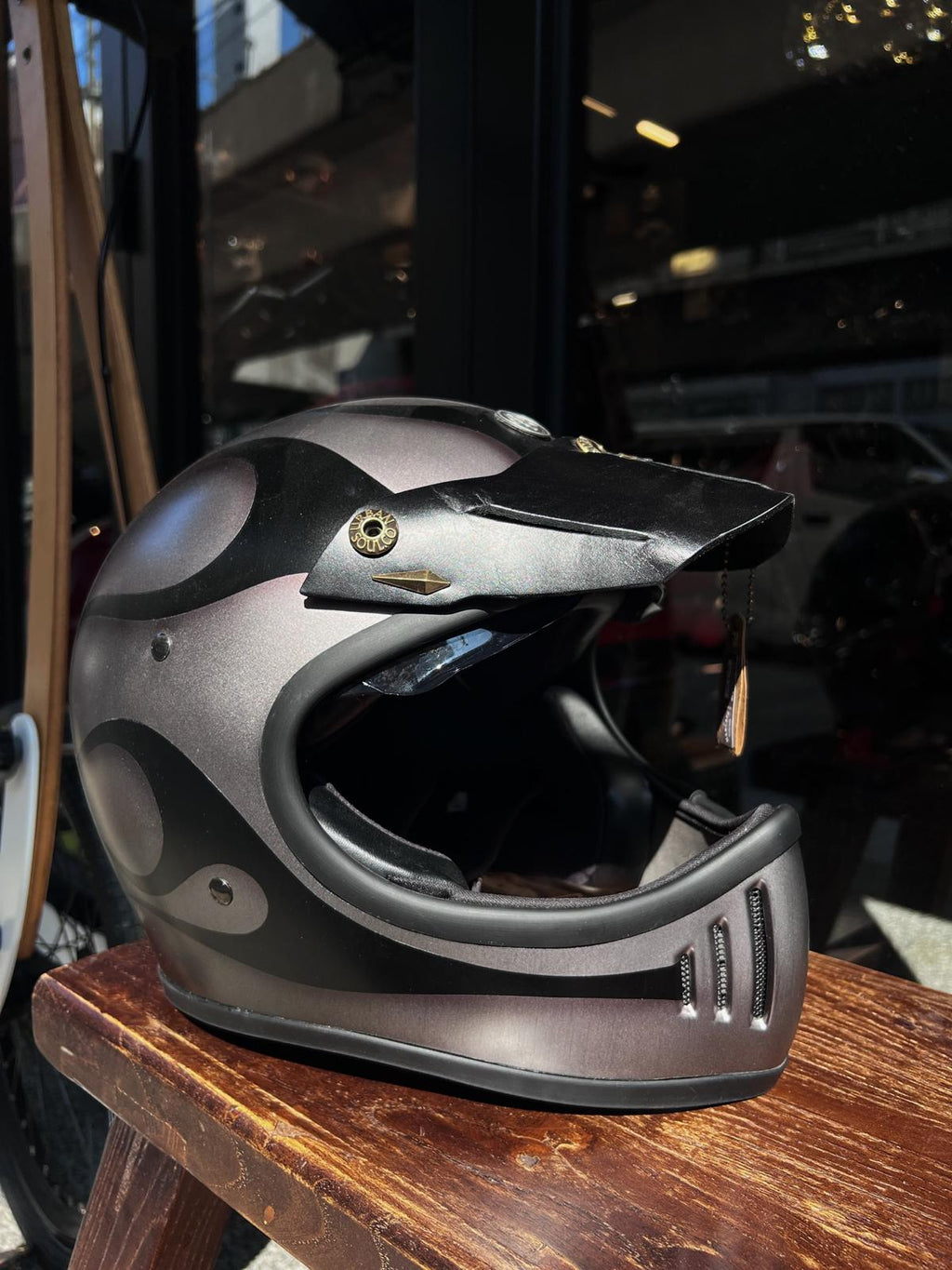 Taiwan brand Air Runner helmet and Urban Soul leather visor display in The Mancave Kowloon Harley Davidson motorcycles repair shop